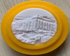 A yellow circular object with a white circle in it

Description automatically generated