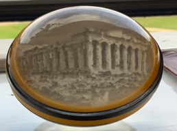 A circular object with a building in the middle

Description automatically generated