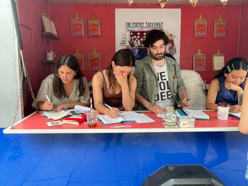 Yanita Georgieva at a collaborative poetry event with other poets.